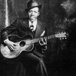 Logo of the podcast ROBERT JOHNSON E LE ORIGINI DEL BLUES Podcast ROBERT JOHNSON E LE ORIGINI DEL BLUES